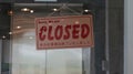 Sorry We Are Closedâ sign hanging inside a room. Royalty Free Stock Photo