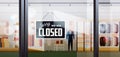 Sorry we are closed sign hanging outside male clothes shopping mall coronavirus pandemic quarantine