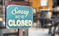 Sorry we are closed sign hanging outside a restaurant, store, office or other