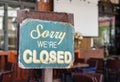 Sorry we are closed sign hanging outside a restaurant, store, office or other Royalty Free Stock Photo