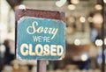 Sorry we are closed sign hanging outside a restaurant, store, office or other Royalty Free Stock Photo