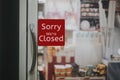 Sorry we are closed sign hanging outside a restaurant, store, office or other Royalty Free Stock Photo