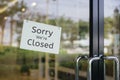 Sorry we are closed sign hanging outside a restaurant, store, office or other Royalty Free Stock Photo