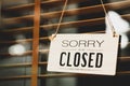 sorry closed sign on shop door.