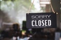 sorry closed sign on shop door.