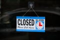 Sorry we are closed sign on shop door window Royalty Free Stock Photo