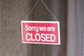 Sorry we are closed sign in shop window door Royalty Free Stock Photo