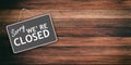 Sorry we are closed sign on wooden background Royalty Free Stock Photo