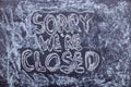 Sorry we`re closed. Chalk lettering on blackboard. Multi colored inscription Royalty Free Stock Photo