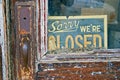 Sorry Closed old grocery small business hardware store entrance sign