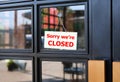 Sorry we`re Closed sign board hanging on door of cafe Royalty Free Stock Photo