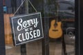 Sorry we re closed sign. grunge image hanging in cafe front. Royalty Free Stock Photo