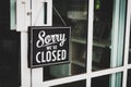 Sorry we\'re closed sign. grunge image hanging on cafe glass door Royalty Free Stock Photo