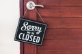 Sorry we\'re closed sign. grunge image hanging on cafe wooden door Royalty Free Stock Photo