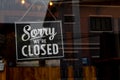Sorry we re closed . vintage black and white retro sign on a coffee glass door. Royalty Free Stock Photo