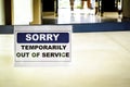 SORRY TEMPORARILY OUT OF SERVICE sign at airport,closed airline business,Coronavirus disease global pandemic crisis,isolation