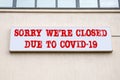 SORRY WERE CLOSED DUE TO COVID-19. Hotels, cafes and service concept. Illuminated advertising Royalty Free Stock Photo