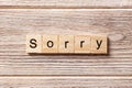 Sorry word written on wood block. sorry text on table, concept Royalty Free Stock Photo