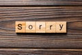 Sorry word written on wood block. sorry text on table, concept Royalty Free Stock Photo