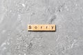 Sorry word written on wood block. sorry text on table, concept Royalty Free Stock Photo