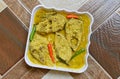 Sorshe Illish or Hilsa fish cooking with mustard seed.famous Bengali food Royalty Free Stock Photo