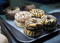 Sorted doughnuts in a bakery display