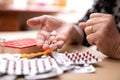 Elderly Hands Sorting Pills