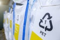 Sorting recyclables. The sorted polyethylene terephthalate PET plastic, is placed in a container with the appropriate marking Royalty Free Stock Photo