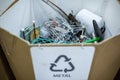 Sorting recyclables. The sorted scrap metal, is placed in a container with the appropriate marking Royalty Free Stock Photo