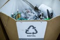 Sorting recyclables. The sorted scrap metal, is placed in a container with the appropriate marking Royalty Free Stock Photo
