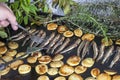 Sorting sardines, Mackerel fishes with potatoes on with potatoes grill plate