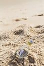 SOS message in bottle on the beach. Royalty Free Stock Photo