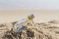 SOS message in bottle on the beach. Royalty Free Stock Photo