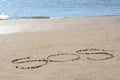 SOS message written on sand near sea Royalty Free Stock Photo