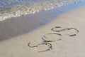 SOS message written on sand near sea Royalty Free Stock Photo