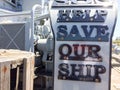 SOS save our ship sign money donation collection box Royalty Free Stock Photo