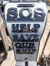 SOS save our ship sign money donation collection box Royalty Free Stock Photo