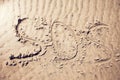 Sos sign write on sand Royalty Free Stock Photo