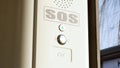 SOS signal button inside the tram, train, emergency help system push button, Braille inscription, detail, closeup Public transport Royalty Free Stock Photo