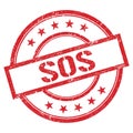 SOS text written on red vintage stamp Royalty Free Stock Photo