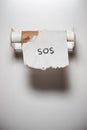 Sos in the toilet. Royalty Free Stock Photo