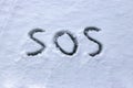 `SOS` written in the snow Royalty Free Stock Photo