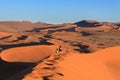Sossusvlei, Namibia, May 11 2015 - Tourists exploring sossusvlei dunes at dawn