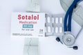 Sotalol medication concept photo. On doctor table is package of cardiac drug with pills and generic name `Sotalol medication` next Royalty Free Stock Photo