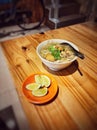 Soto ayam, a typical Indonesian breakfast.  smells of spices and turmeric.  topped with lime. Make it tastier. Royalty Free Stock Photo