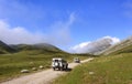 SOTRES, SPAIN - AUGUST 4, 2021: Two white Land Rover Defender Off road vehicles in the mountains