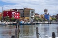 Sottomarina, ITALY - June 10, 2022: Pictoresque streets of old town Sottomarina, colorful buldings in sunlight, red house