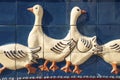 Ceramic tiles with geese on house wall in Soufflenheim. Alsace region in France