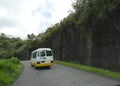 A bus travels along the scenic road in Soufriere, Saint Lucia