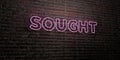 SOUGHT -Realistic Neon Sign on Brick Wall background - 3D rendered royalty free stock image
